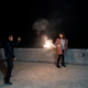 Wang Quanming takes pictures as Zhao Yuqing plays with fireworks on the eve of the Spring Festival in Anxi.